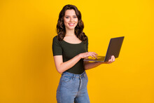 Portrait Of Her She Nice Attractive Lovely Confident Cheerful Cheery Wavy-haired Girl Holding In Hand Laptop Working Remotely Part Time Isolated On Bright Vivid Shine Vibrant Yellow Color Background