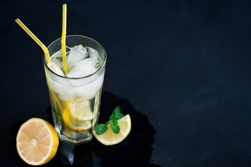 Wall Mural - Summer refreshing cold lemonade Mojito on a dark table with copy space