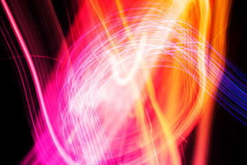 Wall Mural - Abstract light pattern. Blurred neon lights. A dynamic backdrop for your design. Bright orange and pink