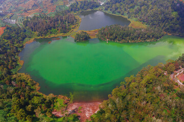 Aerial view of a Colour Lake (Telaga Warna) Dieng (Wonosobo) on a sunny day.