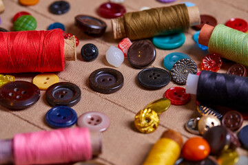 Poster - Background and texture of multicolored antique buttons and sewing tools