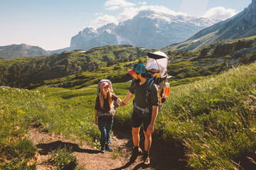 Wall Mural - family vacation hiking couple man and woman traveling with baby outdoor healthy lifestyle tour in mo