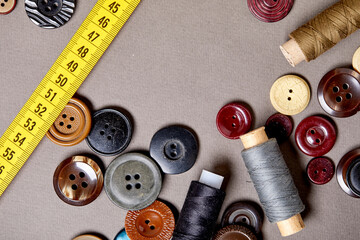 Poster - Background and texture of multicolored antique buttons and sewing tools