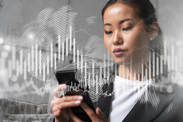 Businesswoman typing phone, work in modern office on new project. forex graph hologram. Double exposure. Concept of success in online trading. Mobile app.