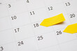 © Kwangmoozaa - Blank yellow sticky adhesive post note paper planner with space on calendar page background for business planning appointment meeting concept