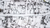 Fototapeta Młodzieżowe - Aerial view of houses in poor areas of Ukraine in a village in winter