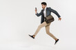 © Drobot Dean - Photo of young businessman using cellphone while running with bag