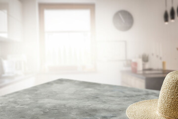 Wall Mural - Hat on the table in the summer kitchen on a sunny morning