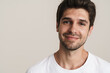 © Drobot Dean - Portrait of joyful young man smiling and looking at camera