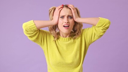 Sticker - A beautiful surprised girl waving her hands and clutching her head due to a misunderstanding of the situation in an isolated studio on a purple background