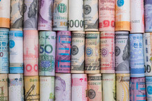 Closeup Rolled Of Variety Banknote And Multi Currency Around The World. Exchange Rate And Forex Investment Concept.-Image.