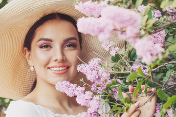 Nice beauty woman with flowers outdoors portrait