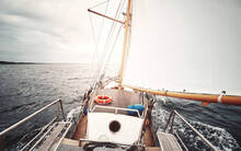 Sailing Against The Sun, Color Toned Picture Of An Old Schooner.