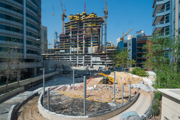 Wall Mural - New building construction site in Dubai. Fast Dubai development concept.
