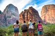© Brocreative - Family looking up at the amazing rock formations at Zion National Park in Utah. A diverse group of children and adults enjoying nature and admiring the Majestic rock cliffs