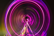 Illuminated Ferris Wheel At Night