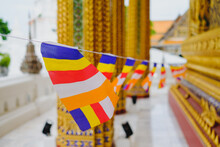 Close-up Of Multi Colored Buddhist Flags Hanging Outside Building