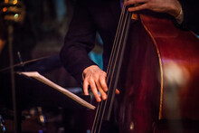 Double-bass Fragment In Jazz Concert Stage In Musican Hands