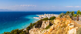 Fototapeta  - View of Rhodes town with azure sea water. Rhodes island, Greece