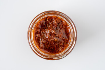 Fresh homemade italian rosso red sundries tomato chili pesto sauce health food cook recipe made from spice pepper herb parmesan cheese nuts for healthy vegetarian vegan meal 