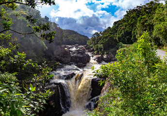 A boiling river with a waterfall in the rainforest