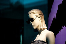 Close-up Of Mannequin Wearing Sunglasses Against Wall