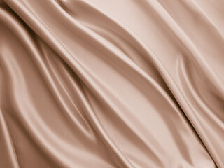 Photography of beautiful smooth elegant wavy beige / light brown satin silk luxury cloth fabric texture, abstract background design. Copy space. Card or banner