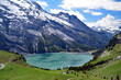  Oeschinen Lake in Switzerland , surrounded by the Bernese Oberland mountains