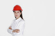 © ImageHit - Businesswoman wearing safety helmet