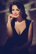 © Denys Kurbatov - Elegant beautiful lady wearing black evening dress. retro style toned image