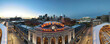 © ARHIT - union station panorama with neon travel by train sign and clock and Denver city skyline in the background at sunrise