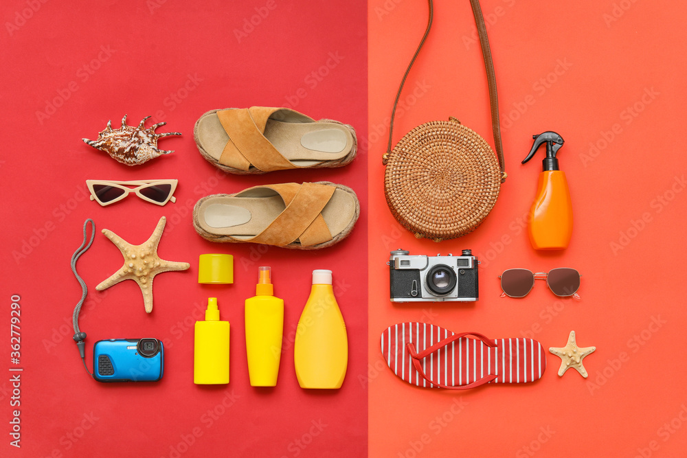 Beach accessories on color background