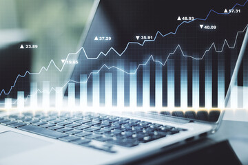 Abstract creative financial graph on modern laptop background, forex and investment concept. Multiexposure