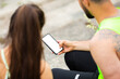 © Georgii - Athletic couple girl and man in stylish sportswear train with phone with empty screen, photography for sport blog or app