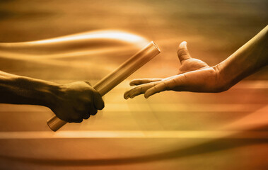 Two men passing golden baton in stadium