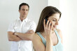 © ImageHit - Man watching his girlfriend talking on the phone