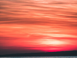 Wall Mural - Abstract of red and golden sunrise and soft clouds