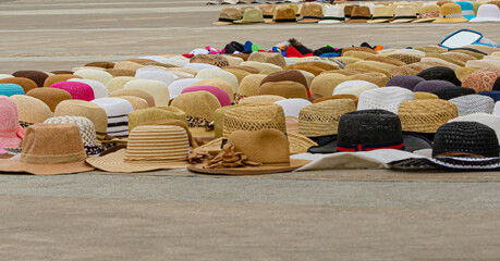 Different hats exposed on the floor.