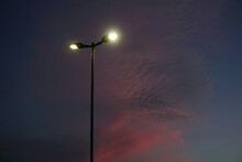 Low Angle View Of Illuminated Street Light Against Sky At Night