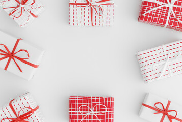 Sticker - Red and white christmas gifts on a white table. Flat lay with blank copy space.