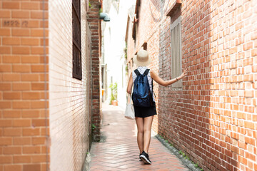 Sticker - woman walking in the old street at Lukang town