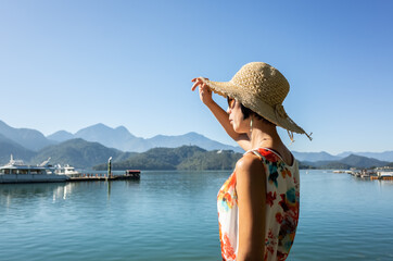 Wall Mural - Asian woman at Sun Moon Lake