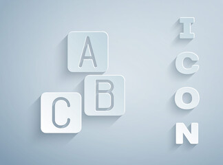 Sticker - Paper cut ABC blocks icon isolated on grey background. Alphabet cubes with letters A,B,C. Paper art style. Vector.