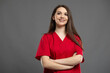 © Catalin Pop - Heroshot of a beautiful young nurse with braces showing confidence