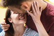 © LIGHTFIELD STUDIOS - smiling young couple embracing and going to kiss at home