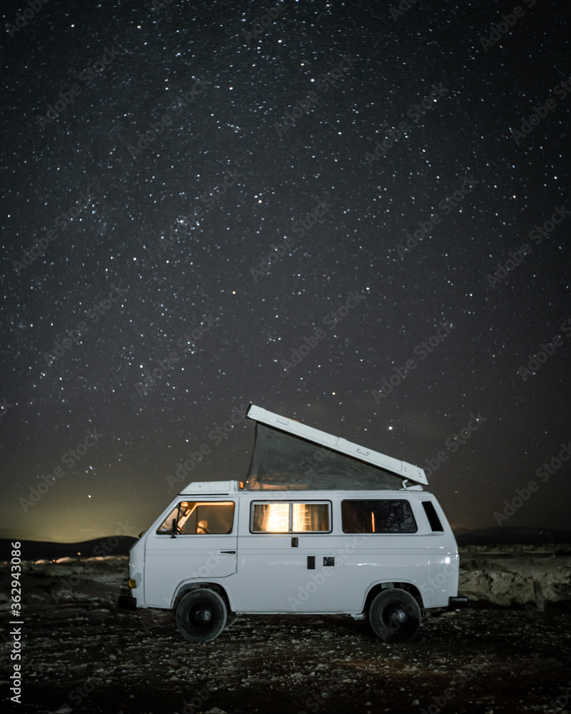 Camper Van On Field At Night - obrazy, fototapety, plakaty 