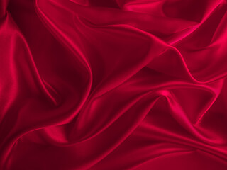 Beautiful smooth elegant wavy hot red satin silk luxury cloth fabric, abstract background design. Wallpaper, banner or card with copy space.