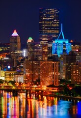 Wall Mural - Vertical shot of the skyline of Pittsburgh in PA with lights at night