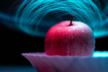 Wall Mural - Wet apple with a abstract background .