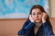 © Ivan - Bored young woman dressed in shirt sitting at high school or col